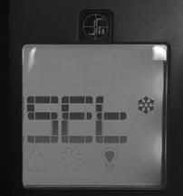 3. While reinserting the battery, push and hold the thermostat key. The temperature bulb graphic will not be displayed on the LCD screen. 4.