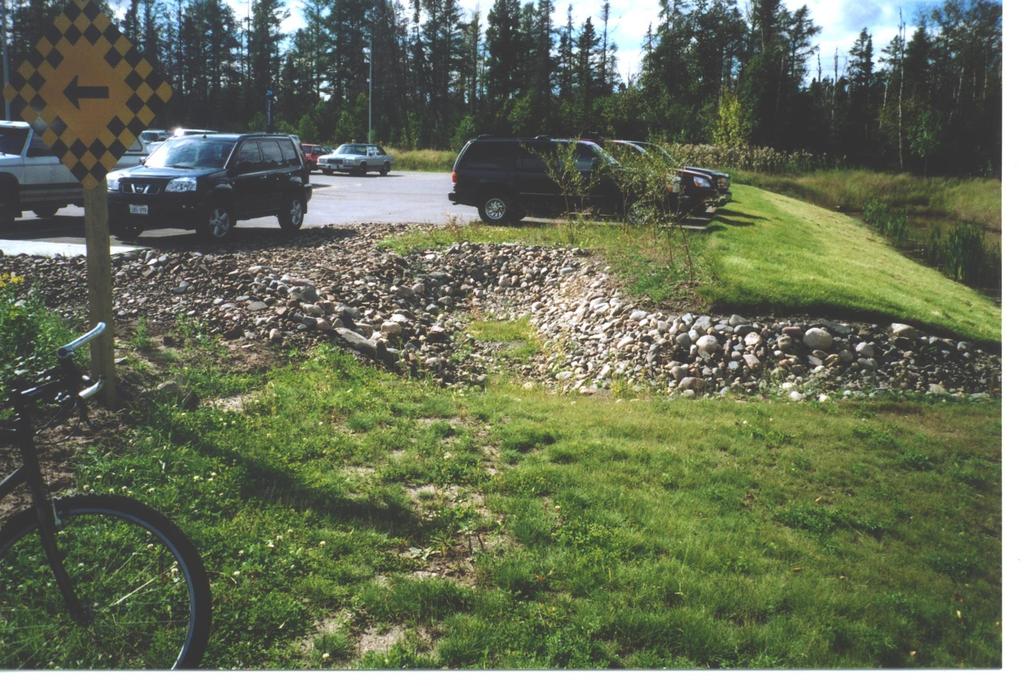 Gravel channel (dry) carries parking lot