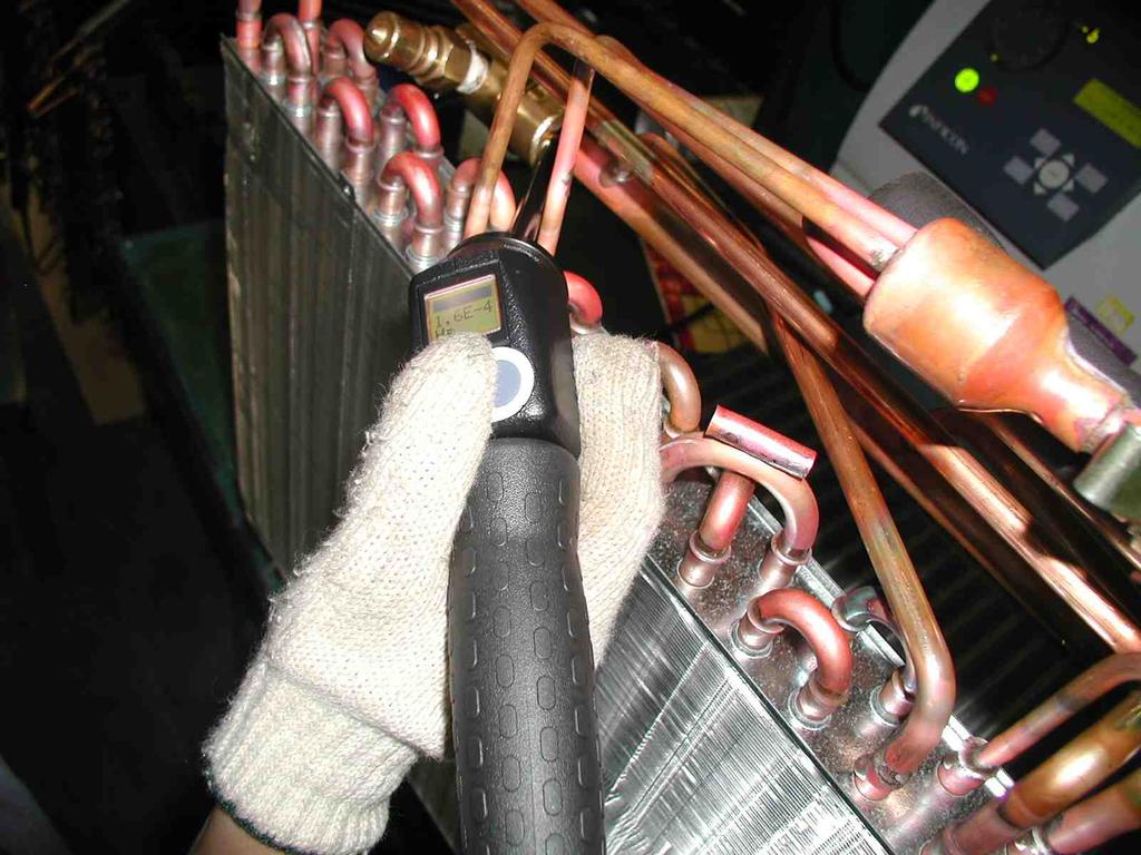 Fig.2 Sniffer probing a complicated assembly of a heat exchanger with a great number of soldered joints Customer Requirements on Industrial Sniffer Leak Detectors The above leads to the following