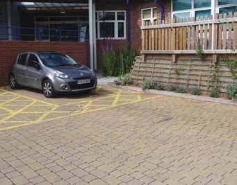 Water from roofs simply trickles down rainwater cupchains or flows from stainless steel spouts onto concrete block permeable paving in the upper car park where it is stored and treated.