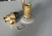Attach the clear hose to the solar circuit. To attach the hose: Ensure the heat exchanger drain valve is closed.