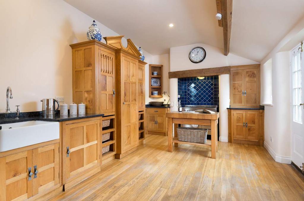To the rear of the ground floor is a spacious kitchen extension with bespoke hand crafted Bur Oak