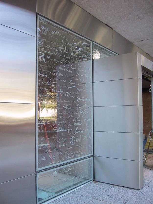 EXTERIOR The Ransom Center entrance features an etched glass signature wall.