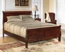 brown finish Louis Philippe styling with sleigh shaped headboard and footboard Antique bronze color hardware and center metal drawer glides