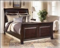 King Panel Bed (82/97) Cal King Panel Bed (82/94) Queen Panel Bed (81/96) B520 Ridgley (Signature Design) Select hardwood solids and veneers in a dark brown finish Satin nickel color knob and back