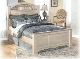 color tipping Large scaled swinging bail with rosettes in a dark champagne color finish Ornate inserts in the mirror and bed crown Traditional base rail cut out