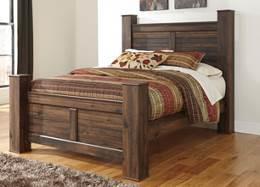 B246 Quinden Warm dark brown finish over replicated oak grain with an authentic wood feel Large scaled rustic pieces feature case pilasters and thick bed posts Slim profile dual USB charger located