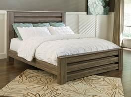 warm gray finish with white wax effect Contemporary and chunky group with a clean look Tall generously scaled case pieces with wide pilasters Modern styled deep panel bed enhanced with horizontal