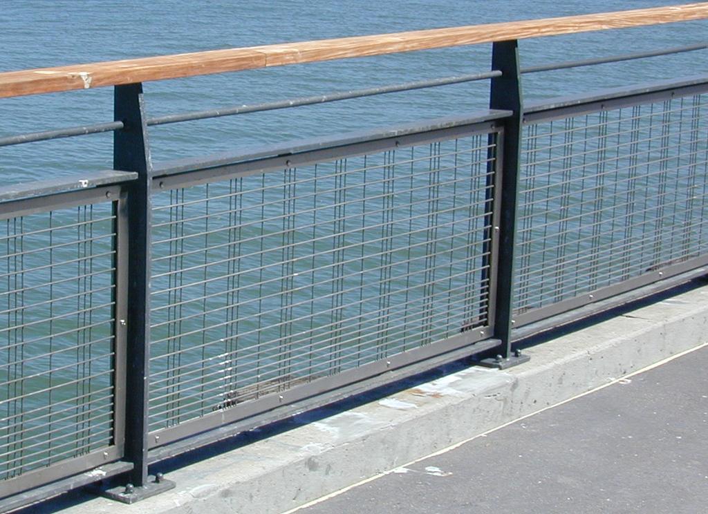 The following is a sample of railing types that meet these criteria: Metal Post/Panel Railing With Wood Top Rail.