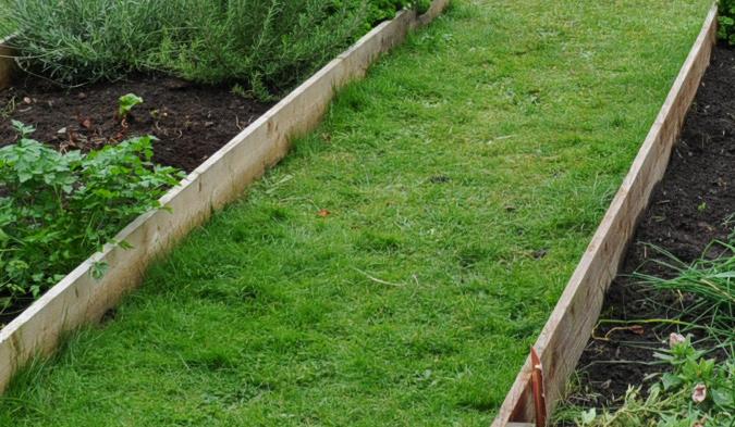 Instructions for building a garden path a Building a grass path Grass paths can be made when digging out new beds in an existing lawn.