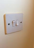 One single and one double light switch.