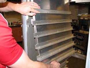 Remove all trays from the cabinet. Remove all side racks (upper and lower for a 990).