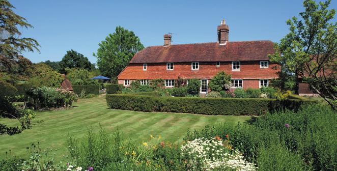 as well as large asparagus beds. To one side of the house is an orchard with fruit trees. Climbing roses and wisteria adorn the elevations of the house.