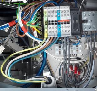 connection in the electric installation compartment UC-S Tighten the screwed cable connection at the backside of the machine Connect the mains connection cable to the terminals PE to N according to