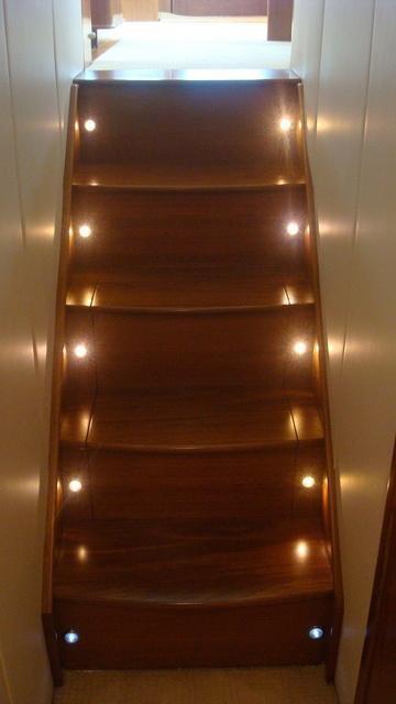TEAK COMPANIONWAY STEPS WITH LIGHTS AND STORAGE BENEATH Central Vacuum included and Located in Storage Area below Steps *CLOSET/PANTRY IN COMPANIONWAY WAS ORIGINALLY THE