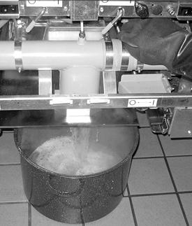 Boil out fry vats (electric fryers only) (continued) 14 Drain solution from fryer. Place a 5-gallon (19-liter) bucket under the fryer's drain.