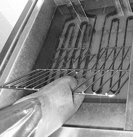 Boil out fry vats (electric fryers only) (continued) 20 Prepare fryer for use. Place the basket support rack in the correct position in the fryer vat.