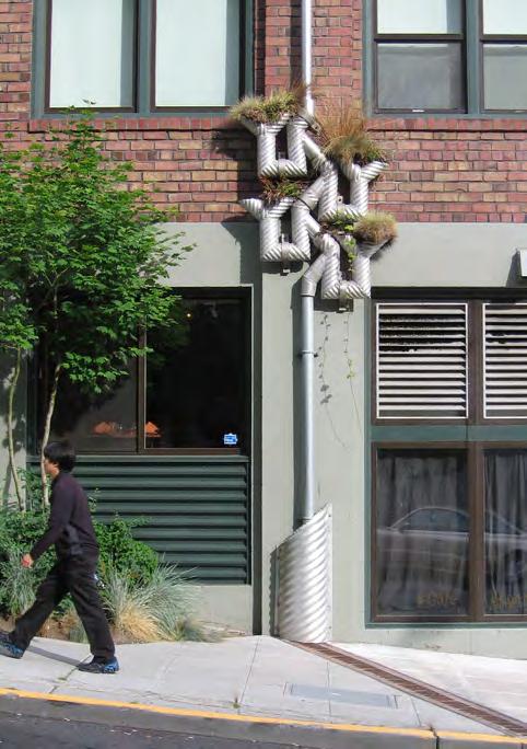 The branching downspout is part of a public art project called Growing Vine Street that uses visual and provocative