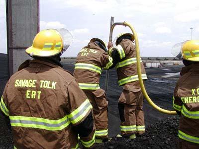6. An emergency response team gets basic training on using a piercing rod on a coal pile fire. Courtesy: Utility FPE Group Inc. The rod is assembled in 5-ft sections.