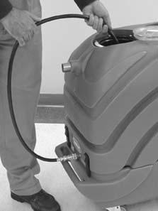 NOTE: If desired, water alone achieves excellent cleaning results. 4. Replace solution tank lid after filling. 5. Connect two 7.6m (25 ft) extension power cords into machine. 6.