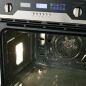 The door system draws air in from the bottom of the oven door up through the door and around the oven cavity, vertically expelling the air up towards the rangehood.