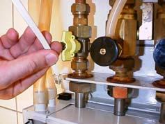 A certified (SCIOS) installer should inspect the unit annually. Unplug the plug of the ionisation probe (low voltage). Remove the two screws from the ionisation clamp.