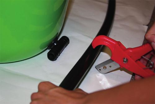 This is a secure connection: Make sure to connect tubing SECURELY onto connector tees and elbows by pushing the tubing COMPLETELY onto the plastic tee connectors and past the barbs as shown below.