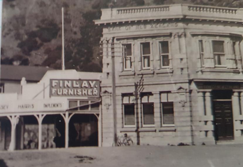 Zealand Pouhere Taonga Act. The commercial façade indicates it operated as Finlay Furnisher in the early 1900s and may post date the BNZ building constructed in 1917.