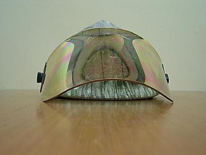Traditional firefighter helmets are designed with a wide brim on the rear of