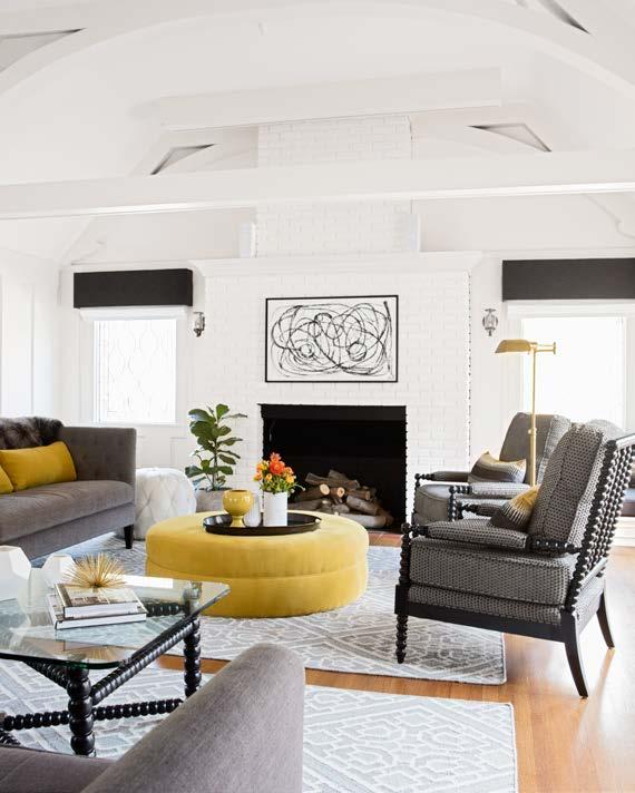Lofty Ambitions Comfy chic rules in the living room, thanks to a pair of custom-made plush sofas and cozy wool rugs.