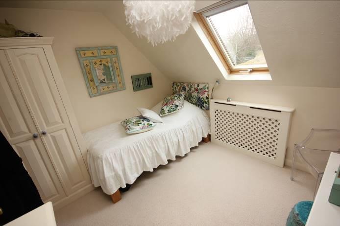 49m ()11' 4" x 8' 2") Radiator with lattice cover and fitted wardrobe.