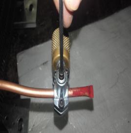 a piercing valve in the compressor service tube. 10.