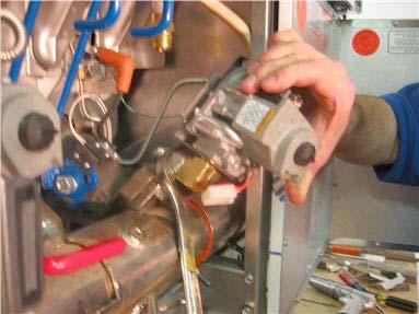 For Full Tank valves, remove screw securing heat shield to valve using 1/4 socket. c.