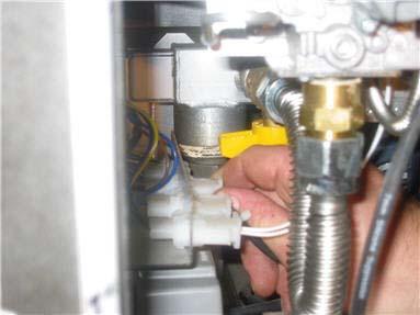 Remove 2 screws securing probe bulb clamp inside tank using Phillips screwdriver. Remove bulb clamp. 5.