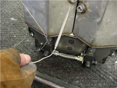 On split tanks, tighten ferrule nut, using 7/16 wrench.