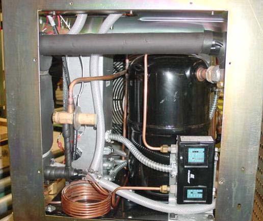 Part V: Refrigeration System Bottom Rear View of a RC045 Condenser fan Compressor Refrigerant pressure control.