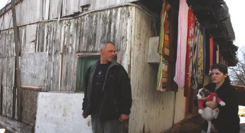 Annual Report 2015 A beneficiary family in Olovo, Bosnia and Herzegovina, pictured in front of their previous house (left).