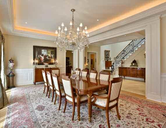 Dining Room The formal Dining Room features hardwood flooring, wainscoting, coffered ceiling with