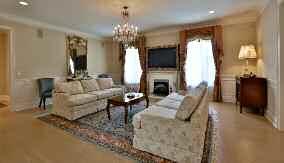 Master Sitting Room and Dressing Area The Master Suite Sitting Room features hardwood flooring, crown moulding, a decorative fireplace with the Dressing area featuring a