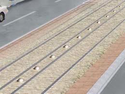 Texture of the trackbed surface could be incorporated to visually and physically differentiate the streetcar tracks from adjacent vehicle lanes, which could be achieved through either stamped/scored