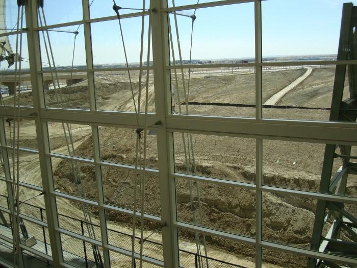 TIE-IN TO EXISTING AIRPORT INFRASTRUCTURE: A large foundation hole is dug for the temporary