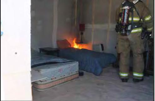 1) Fire Load Arrangement Cell 1 Photo 4 - Quadrants 1 & 2 The fire was set by applying an open flame to the side of a mattress at the extreme