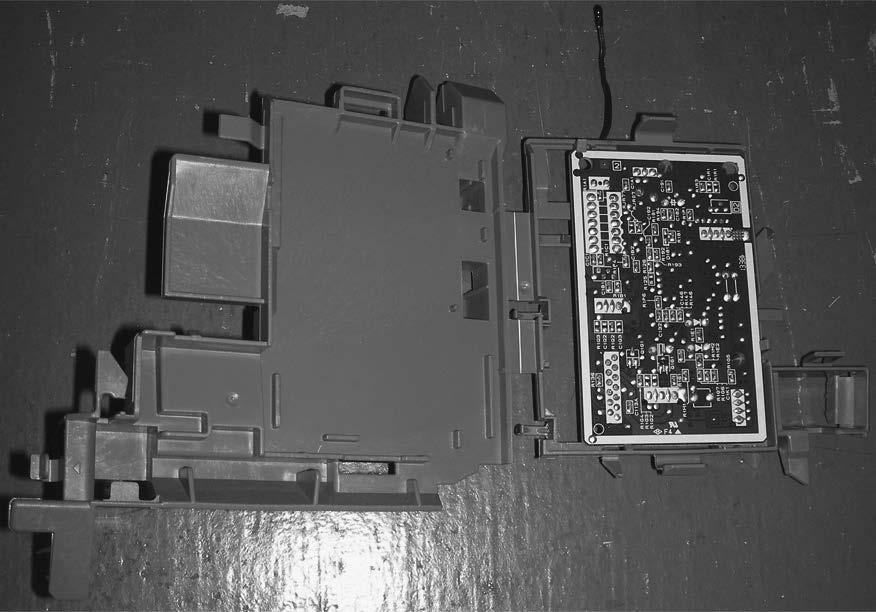 C. board from the control P.C. board holder. PHOTOS Photo 5 Control P.C. board holder (Inside) Catch Indoor electronic control P.C. board Catch Control P.C. board holder (Back side) Room temperature thermistor 4.