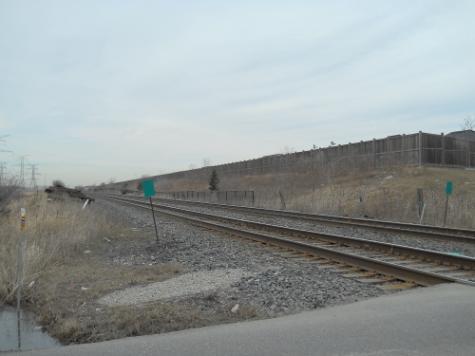The St. Lawrence & Hudson Railway (GO Milton Line) with freight and GO service, including the Lisgar GO Station to the east of Ninth Line at Argentia Road and Tenth Line.