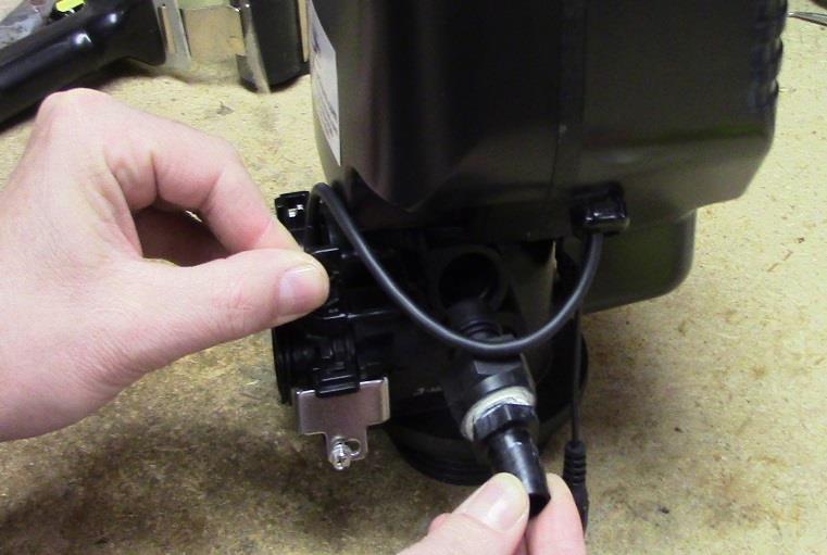 Assemble The Drain Line Flow Control Hose Barb: Remove the clip, and then remove the Drain Line Fitting.