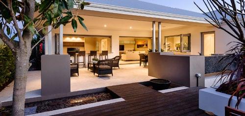 home. Overlooking this gigantic space is the generously sized kitchen, where the large island bench offers a commanding