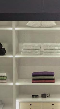 Functional intermediate units give the endless add-on wardrobe front system a light and airy feel.