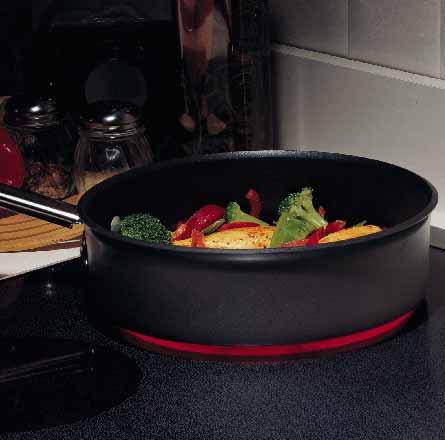 The cooktop has four ribbon heating elements positioned beneath the smooth surface.