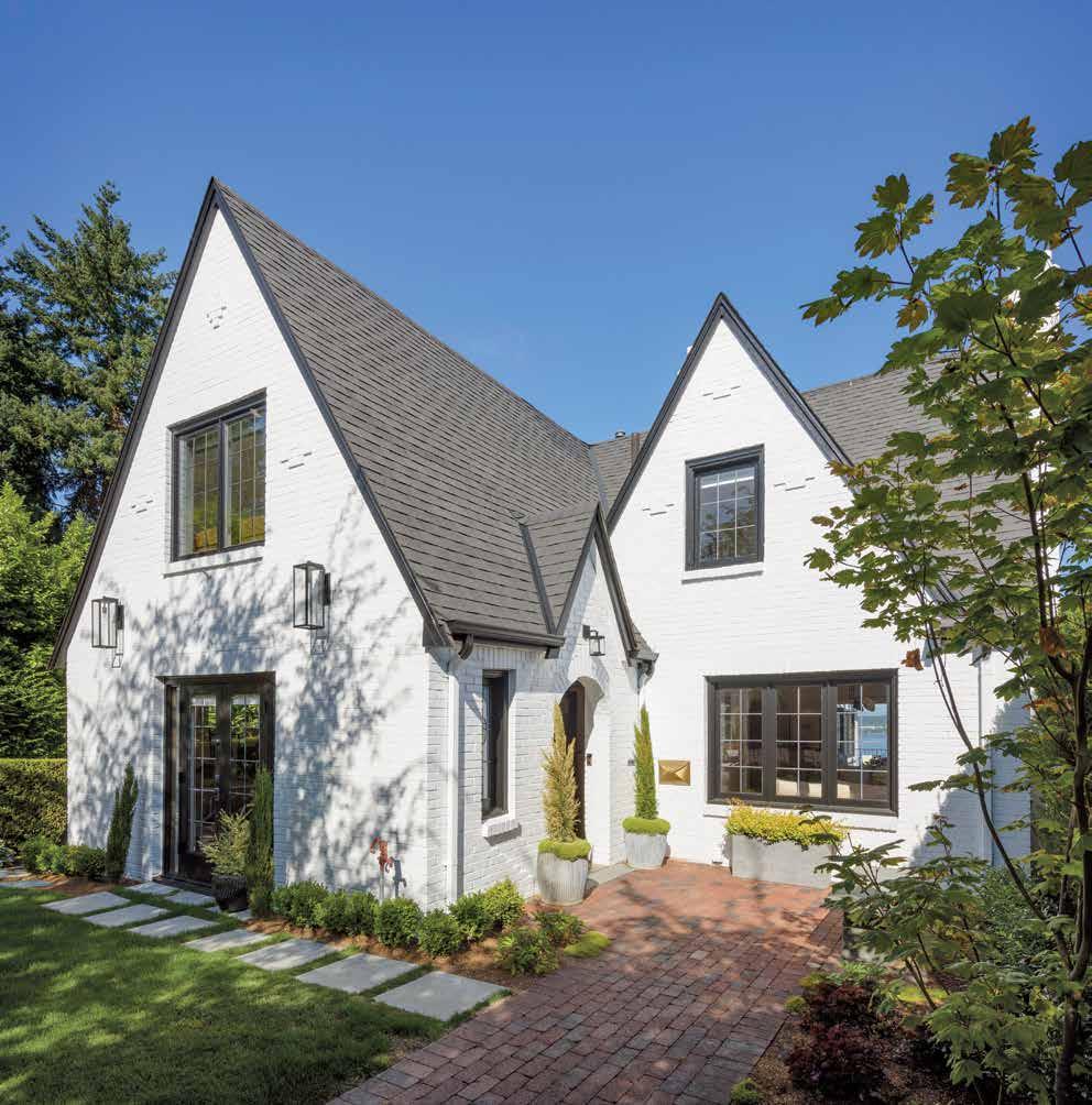 To update the Tudor Revival home in Laurelhurst, it was painted in a crisp white accented with black trim to match the metal windows.