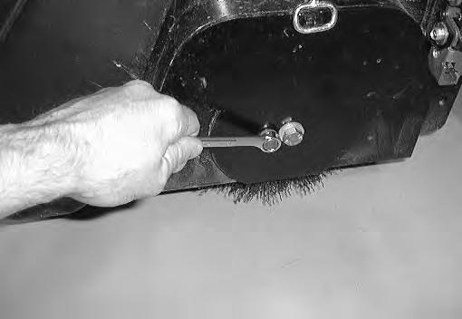 MAINTENANCE C. Raise or lower the end of the brush with the smaller brush adjustment screw as needed to straighten the brush pattern. D. Tighten the mounting screw to secure the brush. E.